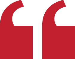 Red quotation marks on black background.