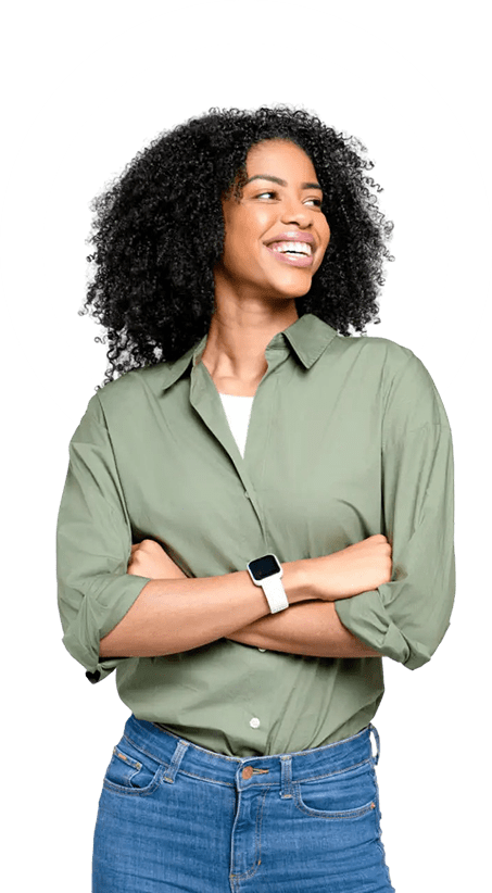 Smiling woman with arms crossed wearing a green shirt and smartwatch.